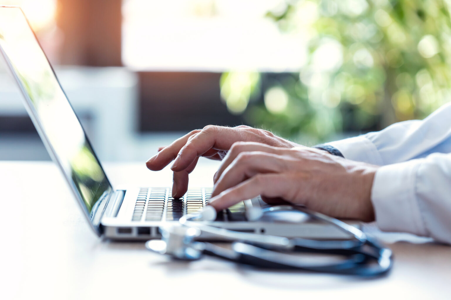 typing doctor using laptop for health research 2026 03 09 05 47 12 utc